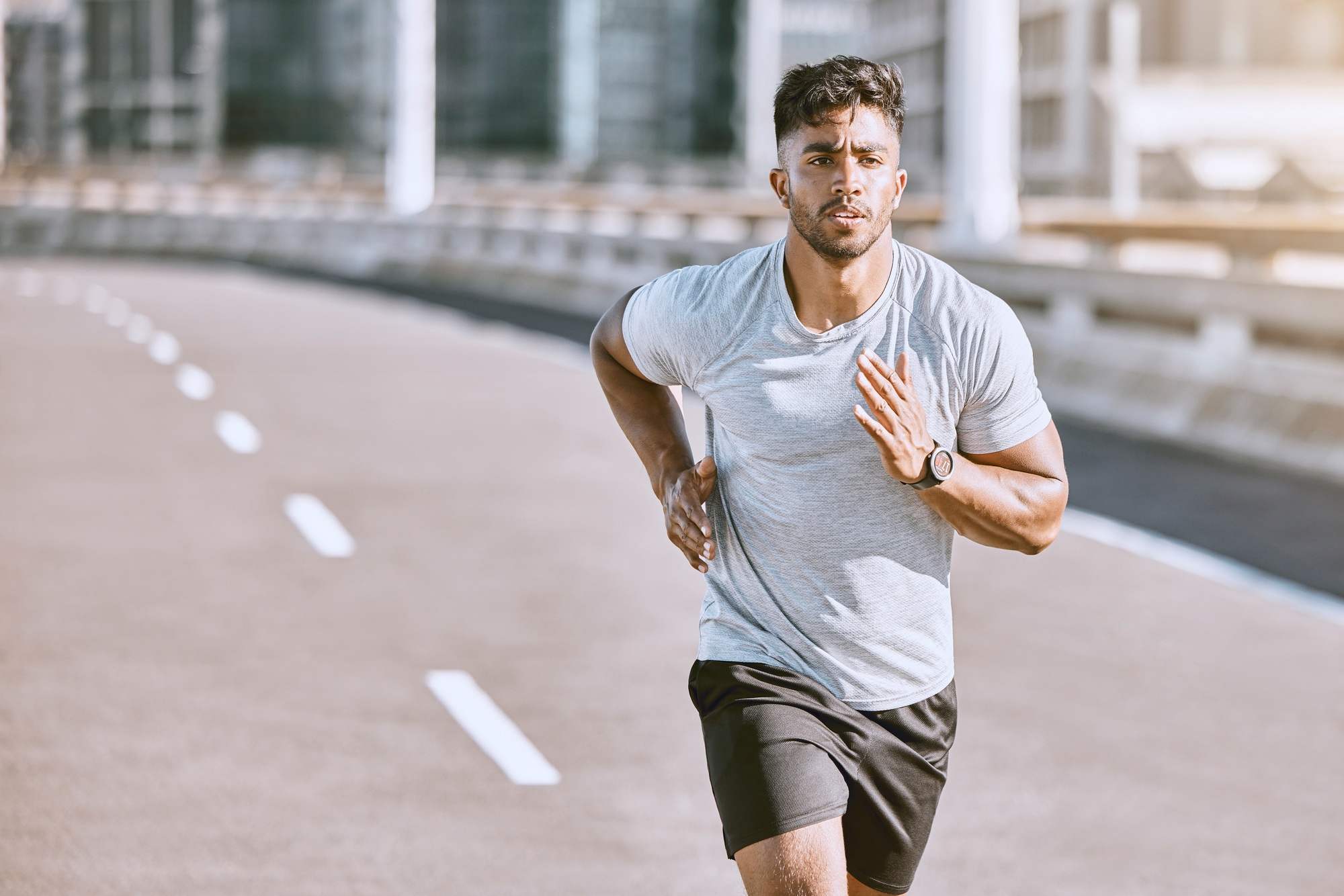 Exercise, workout and training with a healthy man training for sport, fitness and wellness outside