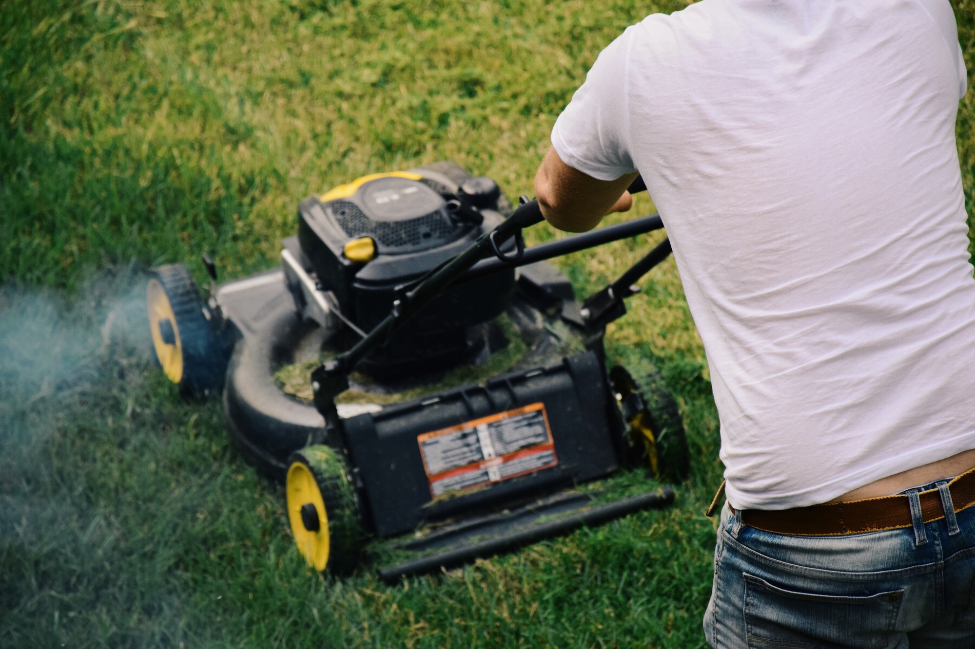 Man is mowing the lawn